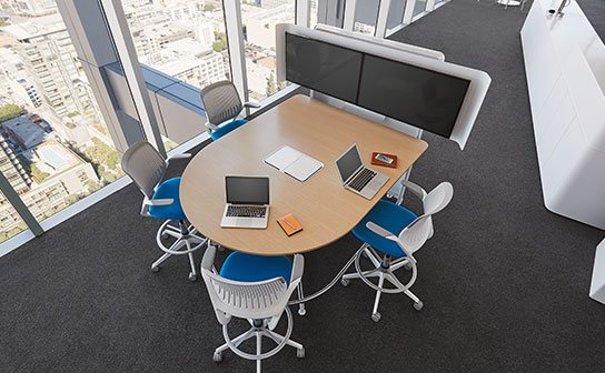 Two Screens with Two Laptops in a Room Image